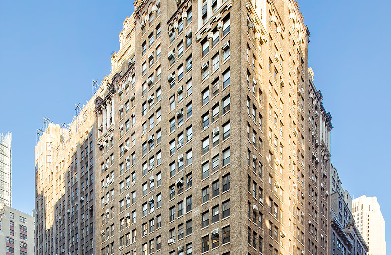 A tall building with many windows and balconies.