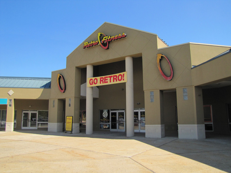 A large building with a sign that says go retro.