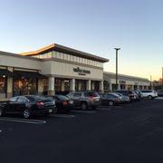 A parking lot with many cars parked in it