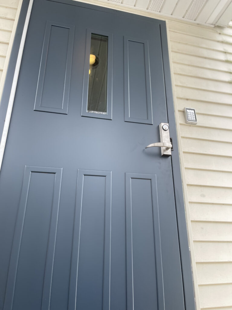 A door with the handle on it and a window.