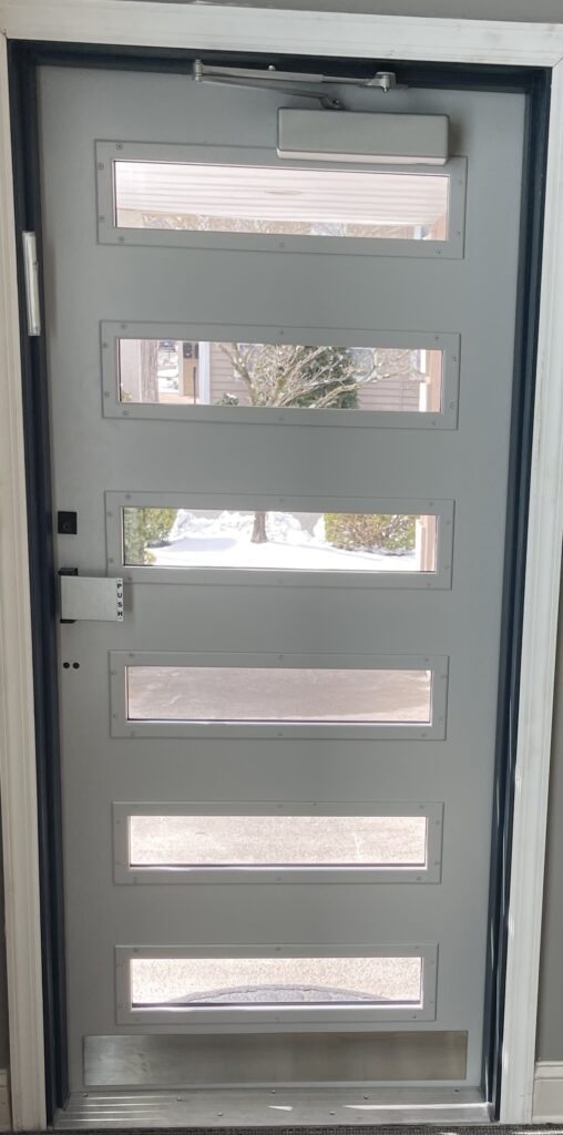 A door with glass panels in the middle of it