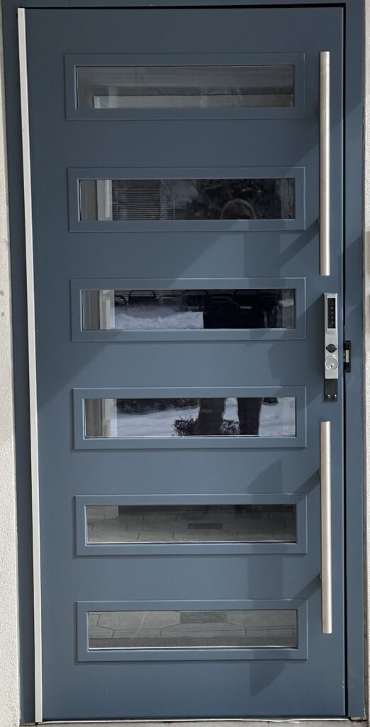 A door with four panels and one glass pane.