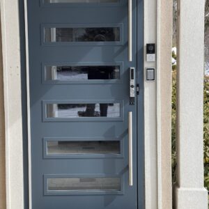 A door with four panels and one glass pane.